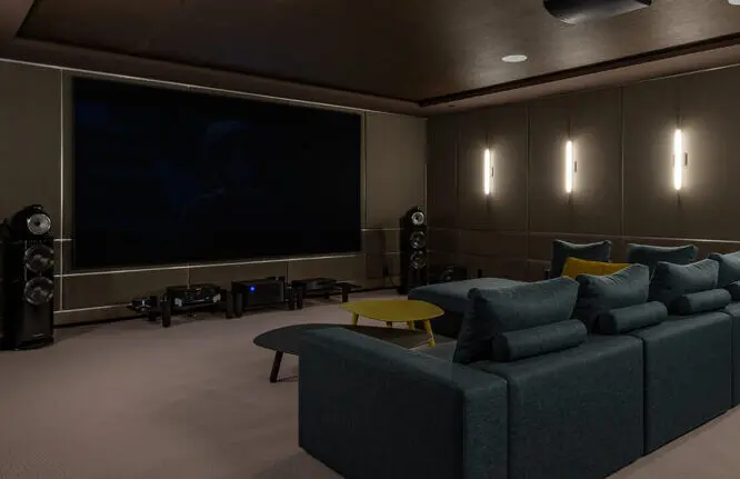 A modern, luxurious home cinema set up with hi-fi systems fitted for surround sounds.