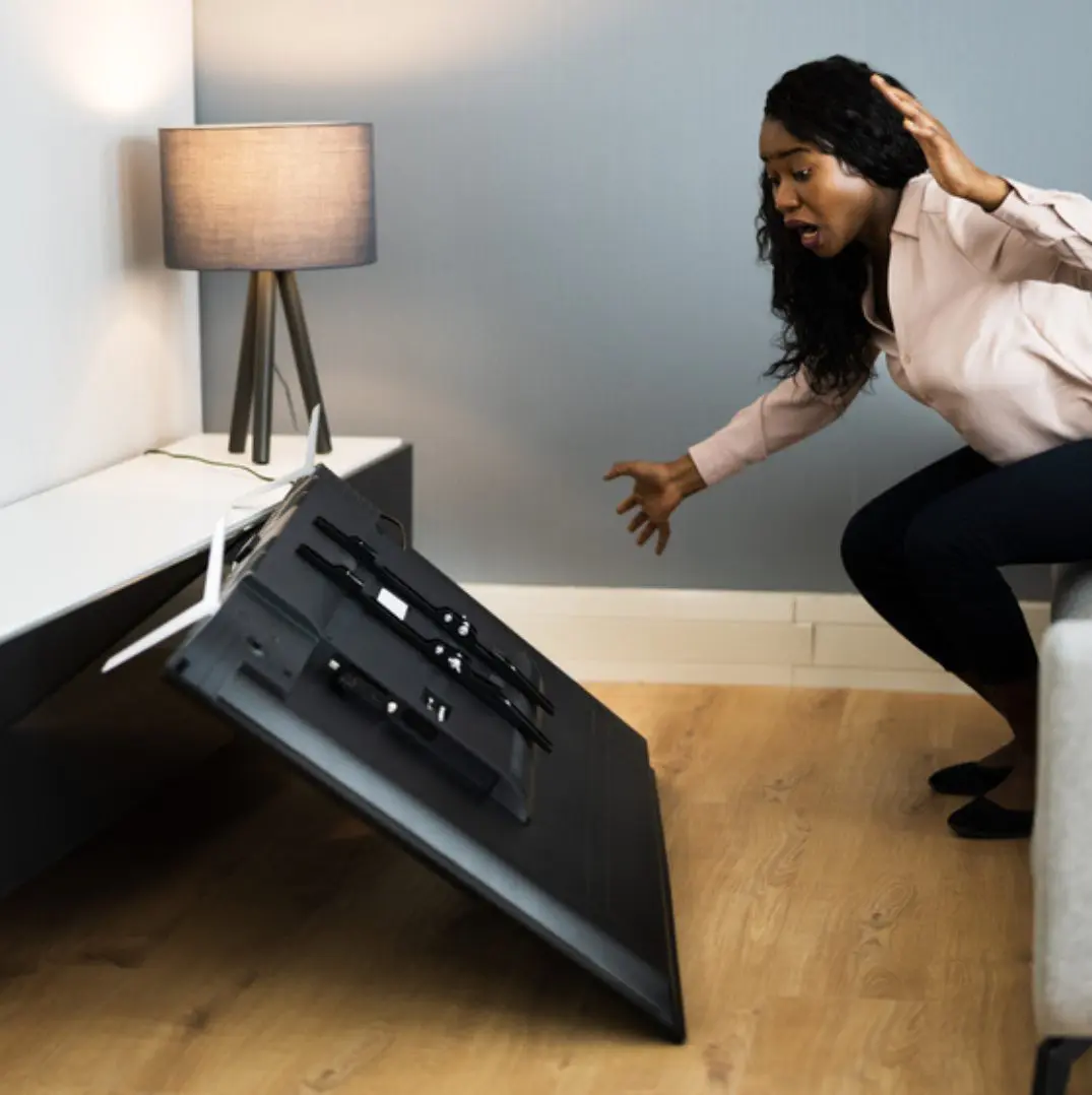 A television was accidentally knocked off the stand and was damaged.