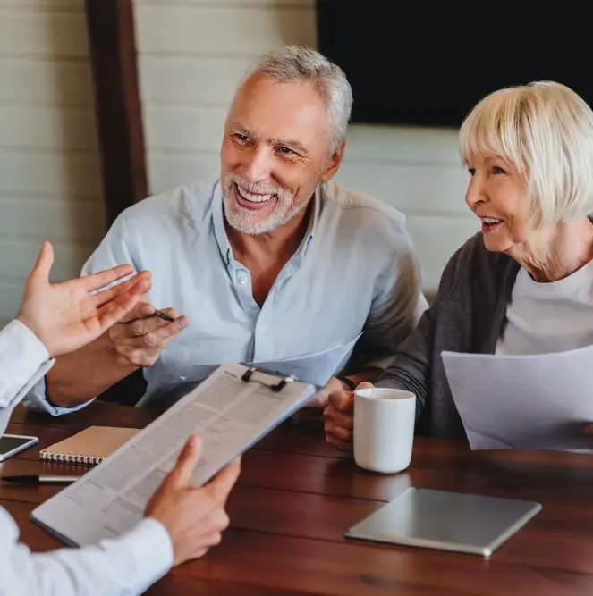 Two clients being explained about their insurance cover by a Personal Client Manager