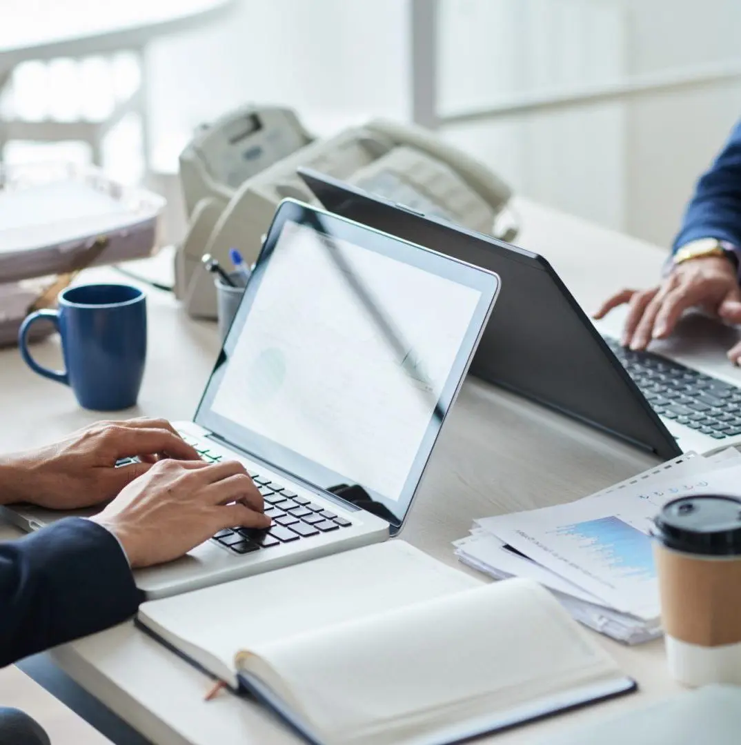 A close up of two laptops.