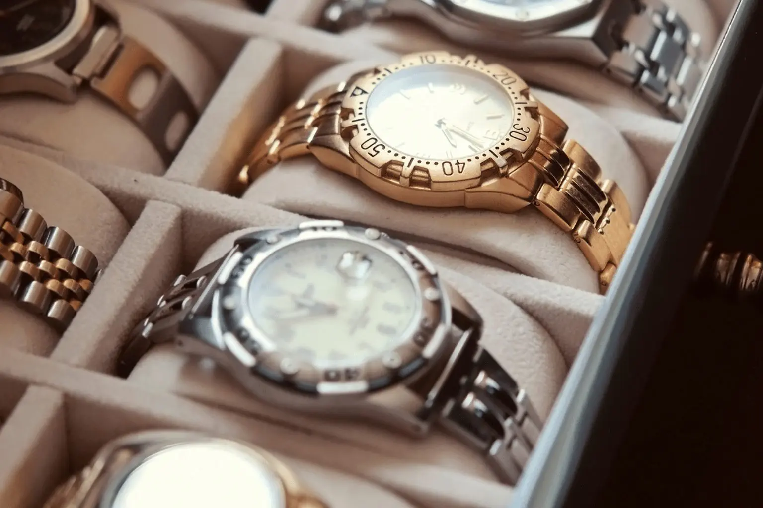 Image of one gold and silver watch in a box