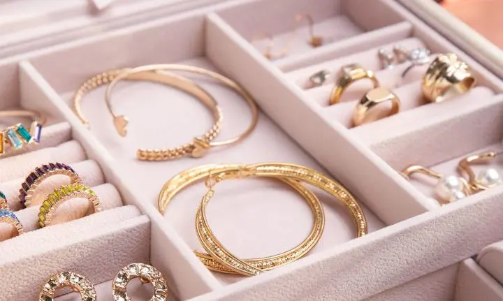 An Image of Gold Jewellery in a White Jewellery Organiser