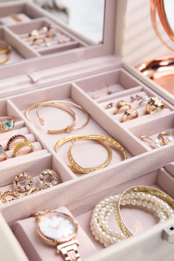 An Image of Gold Jewellery in a White Jewellery Organiser