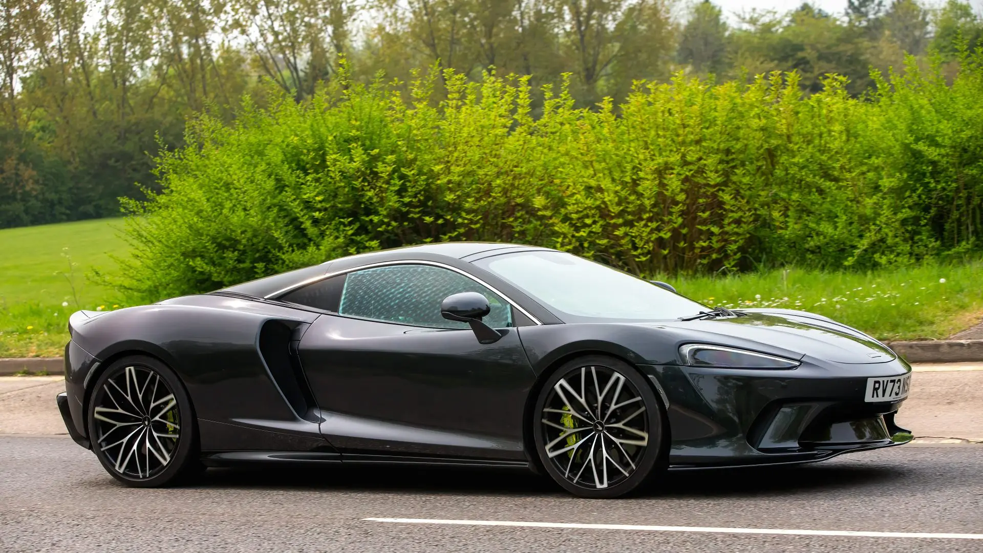 2023 McLaren GT V8 car driving on a British Roaf