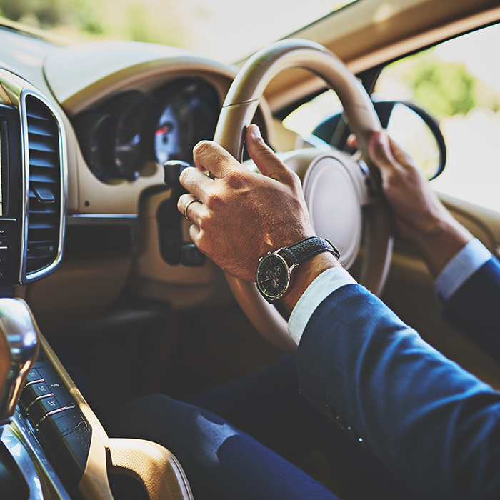 Close up image of man driving vintage car - Norton Insurance Brokers