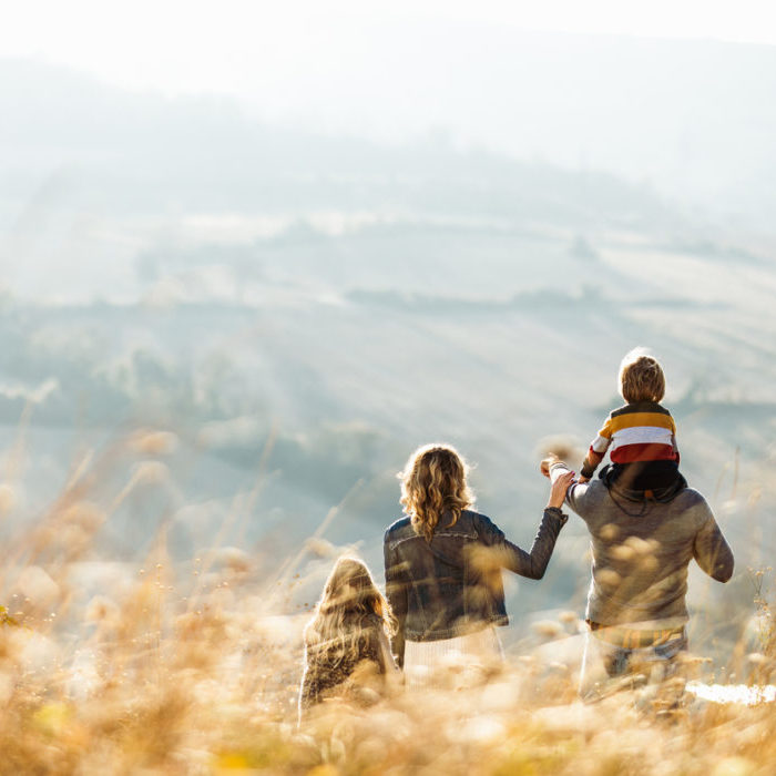 Family walking through the countryside - Norton Insurance Brokers