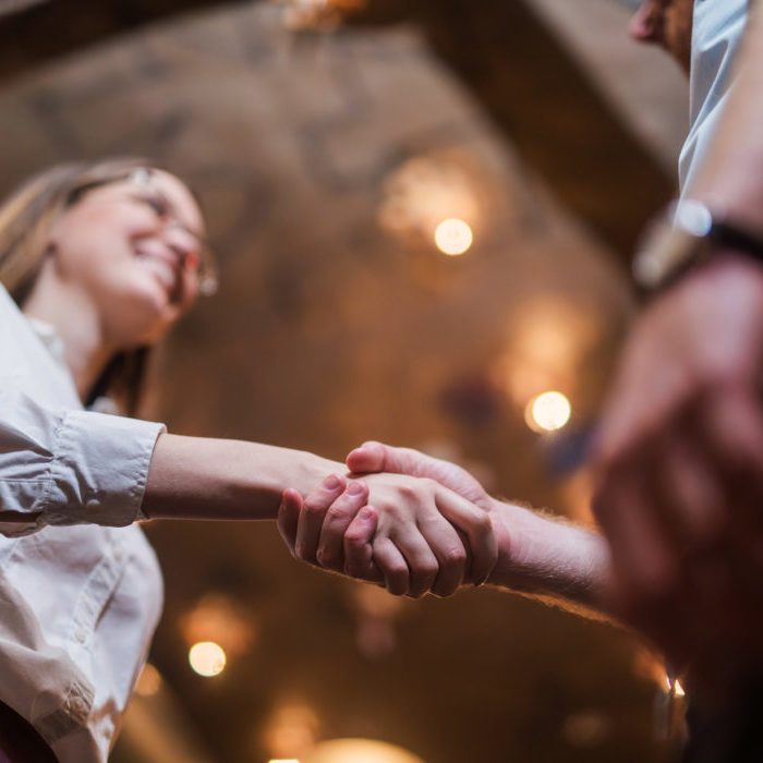 Woman shaking hands - Norton Insurance Brokers