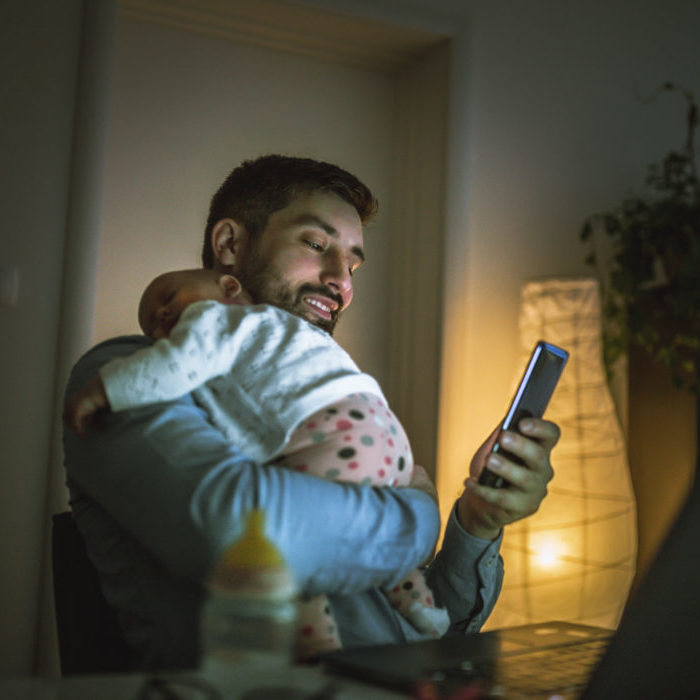 Father working at home with son - Norton Insurance Brokers