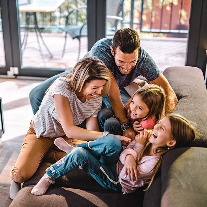 A family together at home - Norton Insurance Brokers