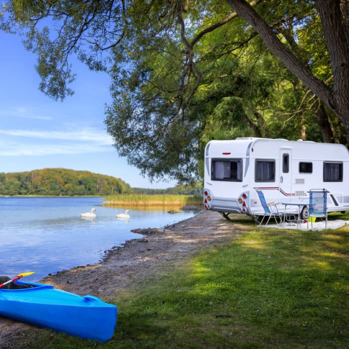 Touring caravan by a lake - Norton Insurance Brokers