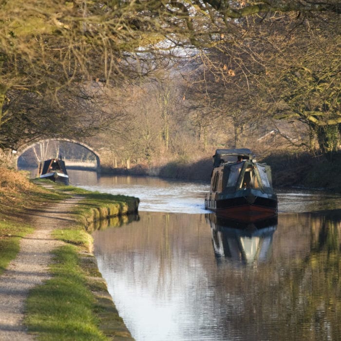 Narrowboats on a canal - Norton Insurance Brokers