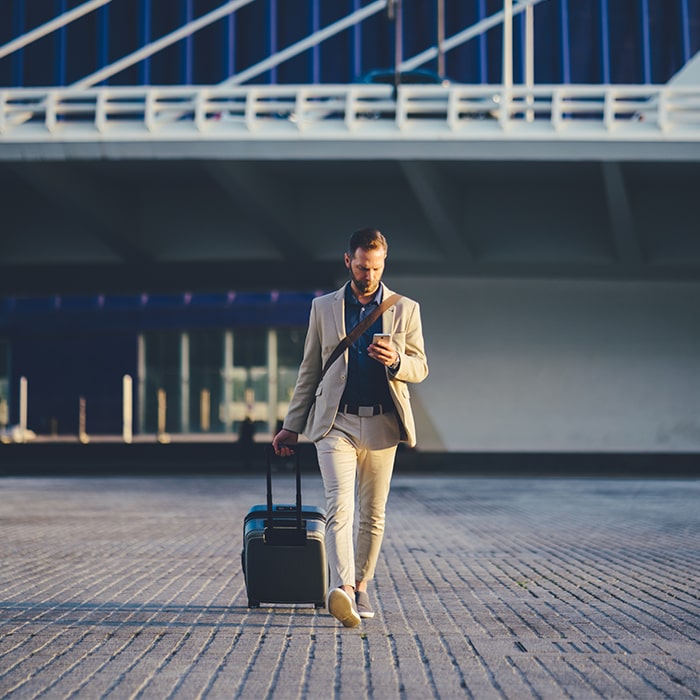 Businessman at airport - Norton Insurance Brokers