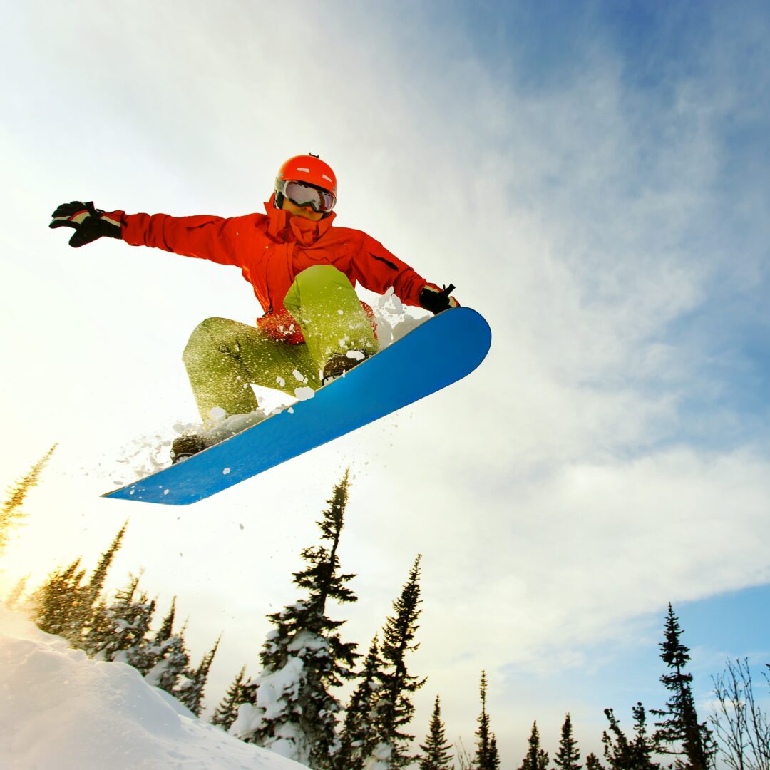 Person enjoying snowboarding in the air.
