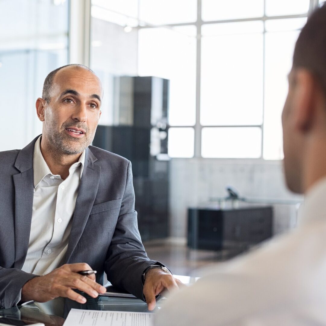 An advisor helping clients with insurance.