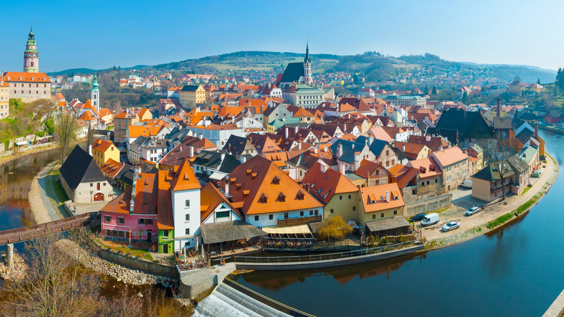 An aerial drone shot overlooking Cesky Krumlov, Czech Republic.
