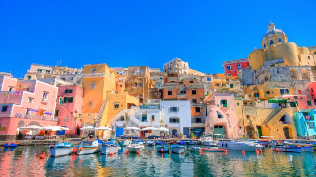 A row of buildings by a marina in Procida, Italy