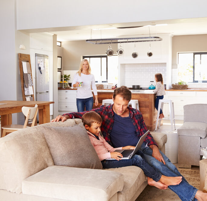 A family relaxing in their large country home.