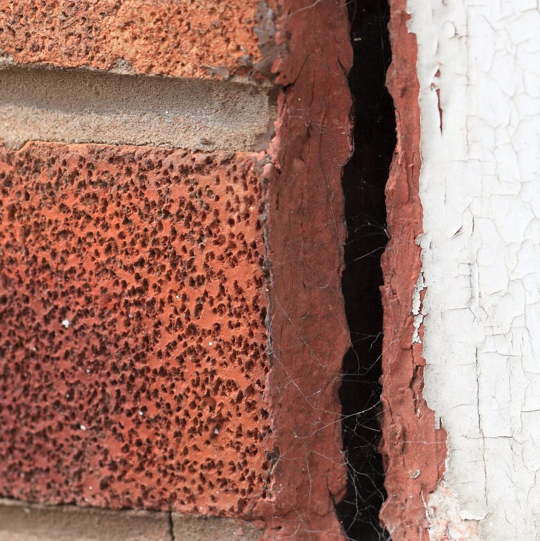 Cracks in a brick wall showing signs of subsidence.