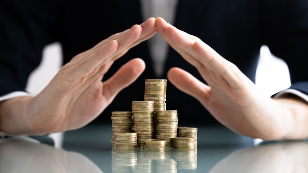 Income being protected by hands.