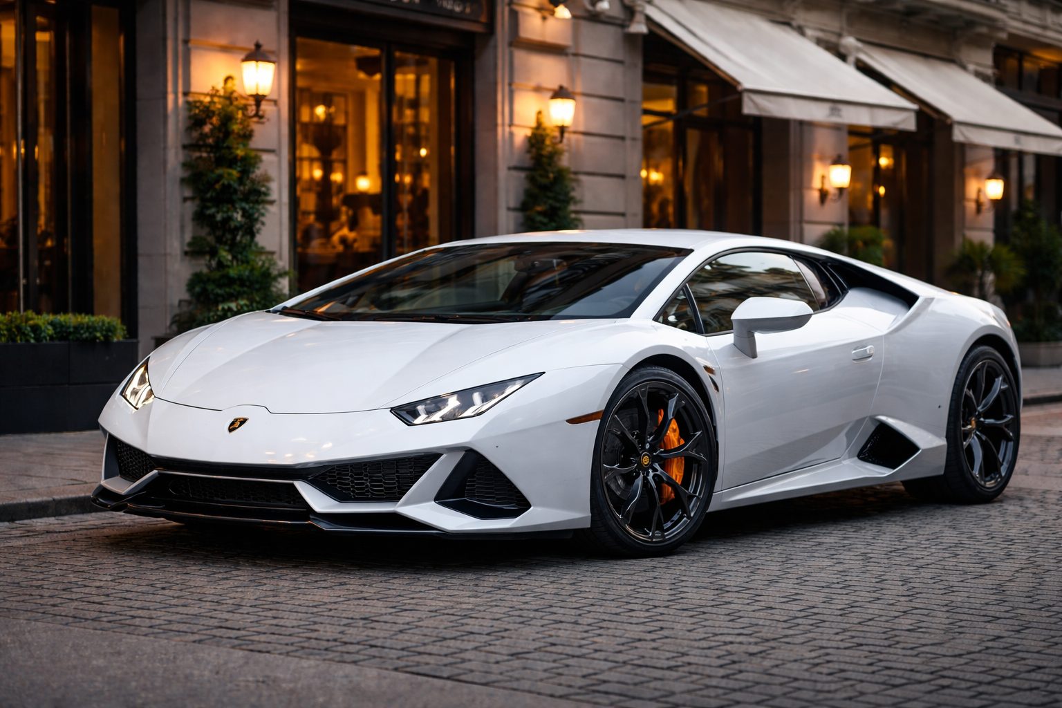 Image of a white Lamborghini in a street.